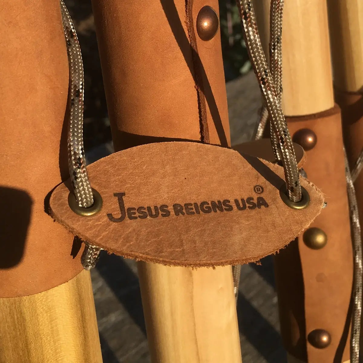 Jesus Reigns USA branded leather tag on handcrafted natural earth tones poplar walking stick