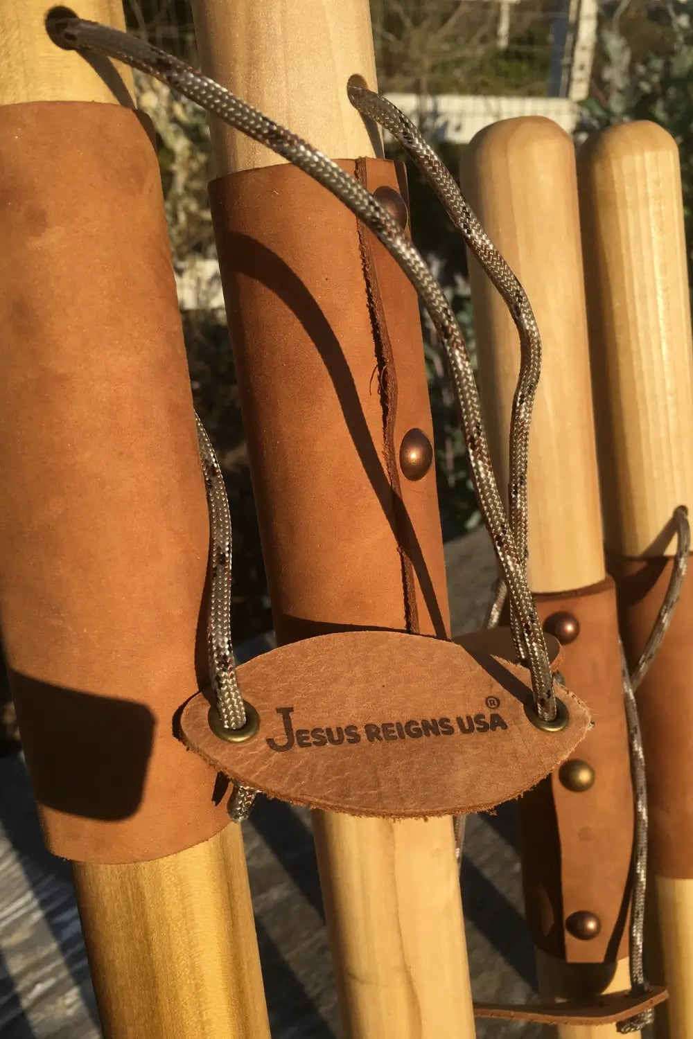 Jesus Reigns USA branded leather tag on handcrafted natural earth tones poplar walking stick