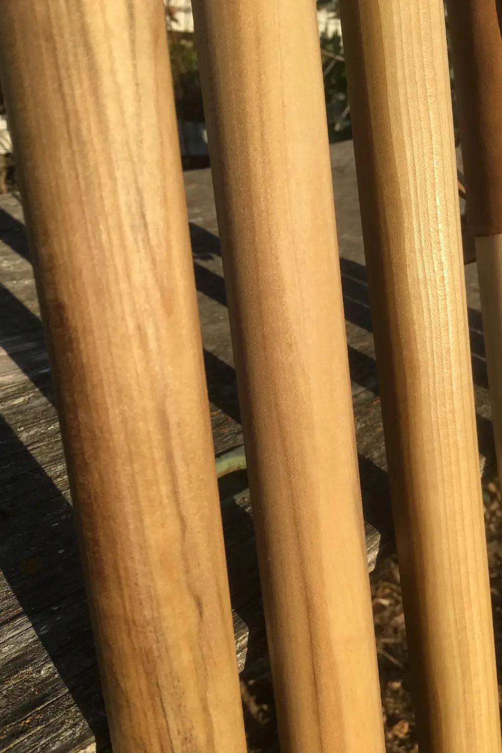 Close-up of A-grade poplar wood grain on handcrafted walking sticks — natural earth tones, made in USA
