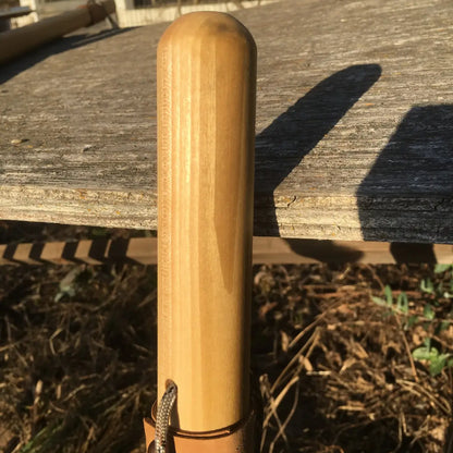 poplar hardwood upper staff shaft with rounded over top and paracord strap peeking up from bottom