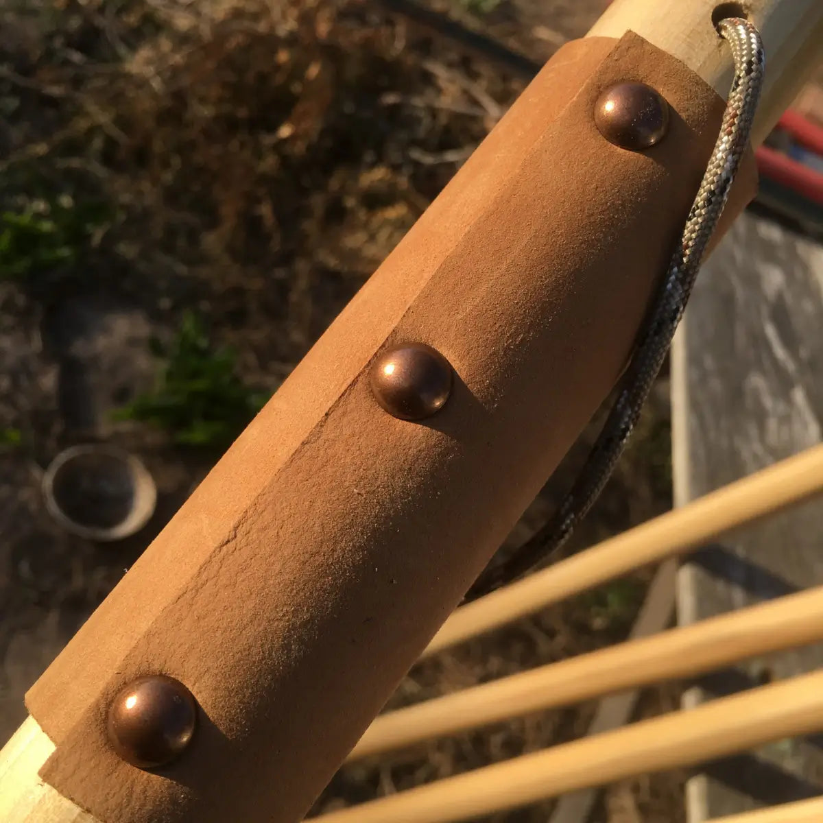	Suede leather wrist strap with antique brass hardware on Jesus Reigns USA hardwood walking stick