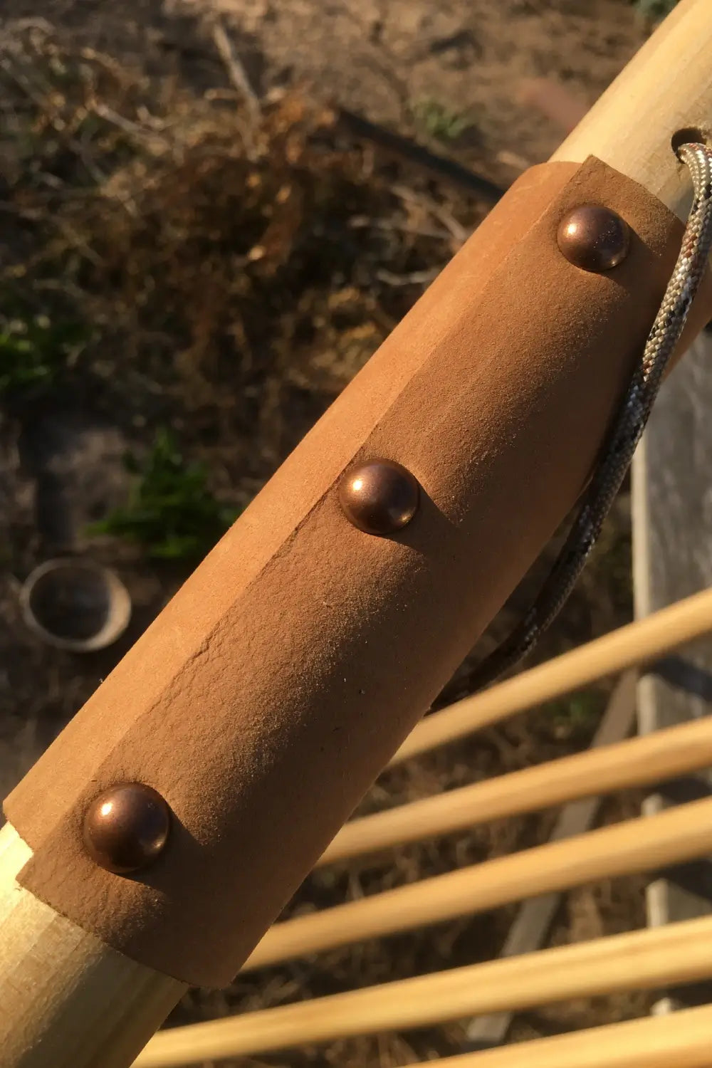 Suede leather wrist strap with antique brass hardware on Jesus Reigns USA hardwood walking stick