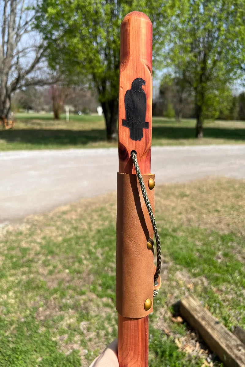 Handcrafted red cedar wood walking stick with engraved perched bald eagle, full leather grip, brass buttons, paracord, made in USA

