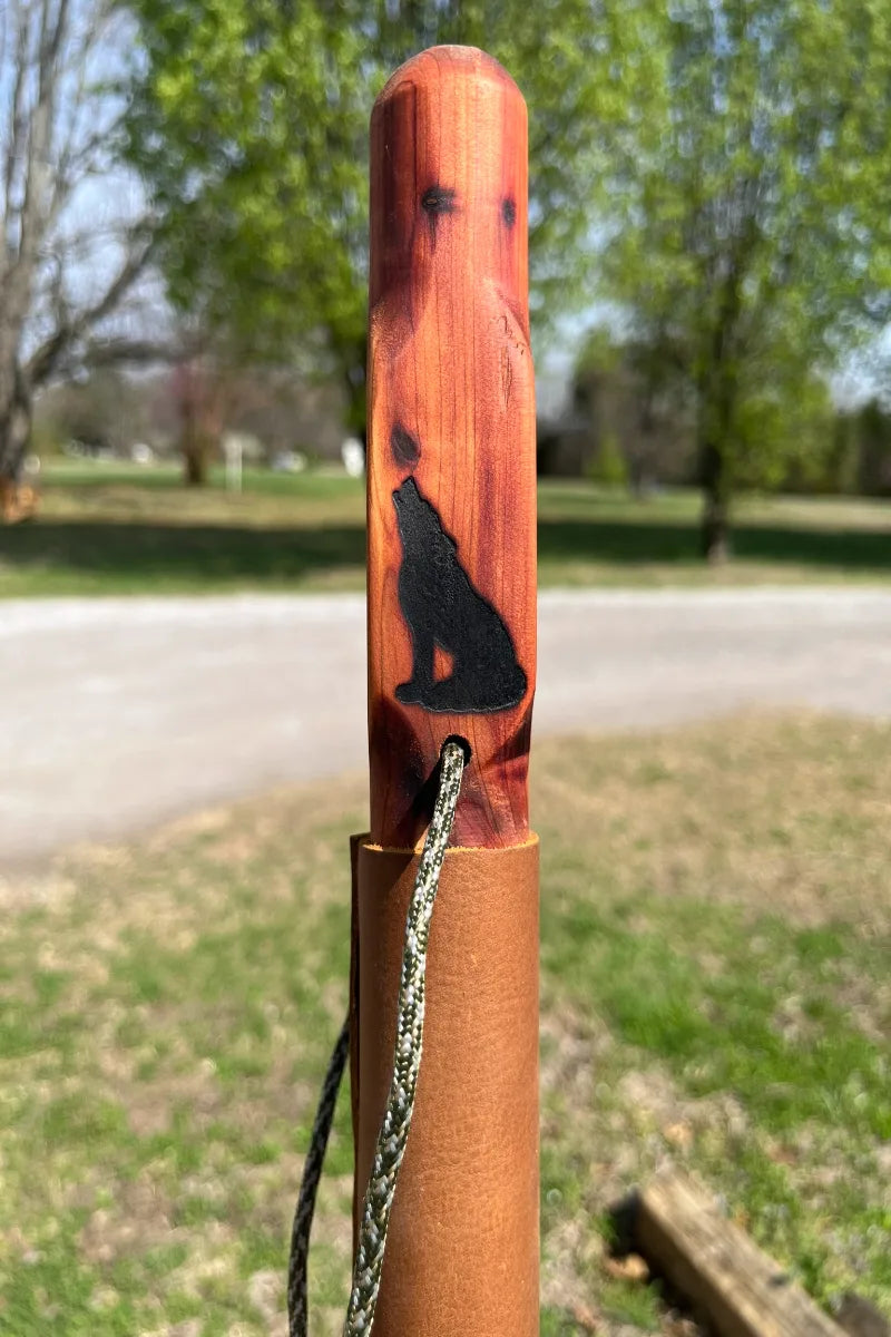 Handcrafted red cedar wood walking stick with engraved wolf, paracord, and leather grip with brass buttons, made in USA