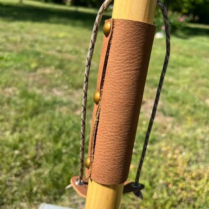 Leather wrist wrap grip with brass rivets and paracord wrist strap